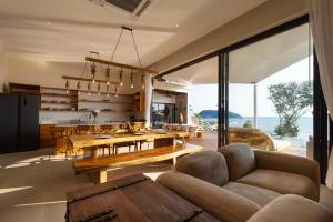 a living room with a table and a dining room at Villa Lotus in Ko Phangan