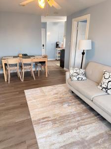 a living room with a couch and a table at Ocean View Cozy Stay 4 in Hull