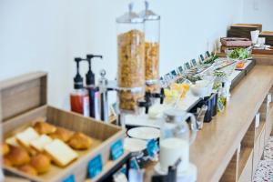 a buffet line with food and drinks at Centara Life Namba Hotel Osaka in Osaka