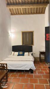 a bedroom with a large bed in a room at 隆馨大悅古厝旅宿 in Jinhu +74 photos