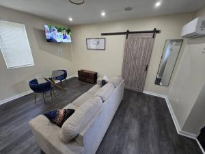 a living room with a couch and a table at G O G Building in Darby