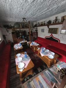 an overhead view of a dining room with wooden tables at Mujagin Han in Srebrenica