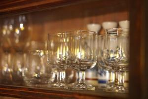 a group of wine glasses sitting on a shelf at こちの宿 in Yamaga