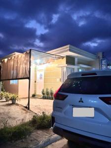 a car parked in front of a house at LoveCo Vacation house close to Dahilayan with private parking in Manolo Fortich
