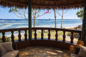 a balcony with a view of the beach at Leimalo's Bungalow in Port Vila