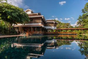 a house with a pool in front of it at Governor's Residence in Yangon