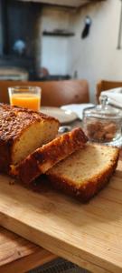 two slices of bread sitting on a cutting board at L'Oustal des Rameaux in Brissac +37 photos