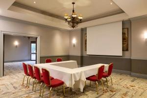 a conference room with a white table and red chairs at Marriott El Paso in El Paso +62 photos