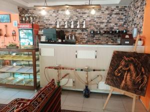 a store with a painting of a horse on the counter at Hotel Cems Sunparadise in Alanya