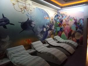 a room with a mural of an aquarium at Hotel Cems Sunparadise in Alanya +11 photos