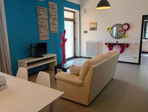 a living room with a couch and a tv at Casa Don Peppì in Monopoli