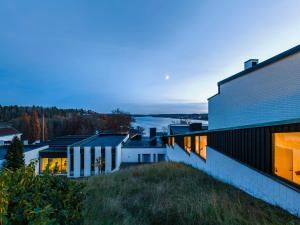 a house on a hill with a view of the water at Bergendal in Sollentuna