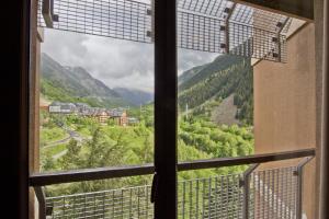 a view from a window of a mountain view at Apartarent 1500 in Baqueira-Beret