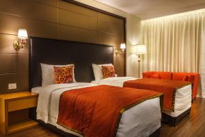 Postel nebo postele na pokoji v ubytování Samanvay Boutique Hotel