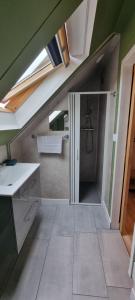 a bathroom with a shower in the middle of a room at Aux Passagers de la Baie 2 Maison 3 Etoiles 2 couchages Terrasse Proche Mer Crotoy in Le Crotoy +32 photos