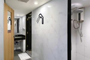 a bathroom with a shower and a sink at MyBed Ratchada in Bangkok +31 photos