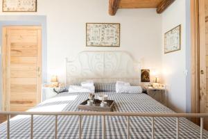 Postel nebo postele na pokoji v ubytování Casa Il Borghetto - Luxury Suites & Pool