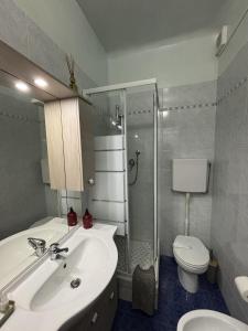 a bathroom with a sink and a toilet and a shower at Da Li Al Mar in Savona +16 photos