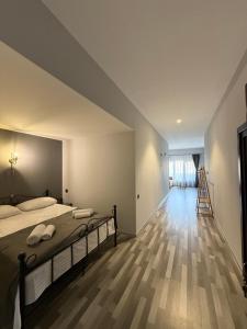 a bedroom with a bed and a wooden floor at Magic View Hotel in Goris +49 photos