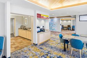 a conference room with a table and chairs at TownePlace Suites Farmington in Farmington