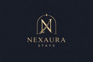 a gold letter n logo with a star in it at Nexaura Stays in Indore