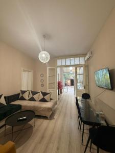 a living room with a couch and a table at Limore Hostel in Tirana