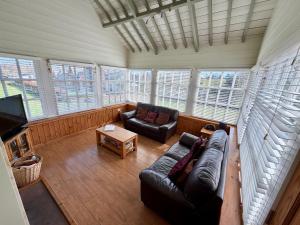a living room with a couch and a table at The Signal Box at Cliburn Station in Penrith