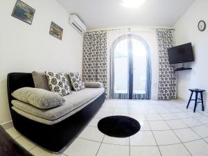 TV a/nebo společenská místnost v ubytování Apartments Villa Mirella