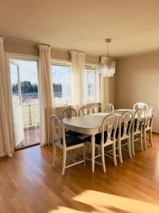 a dining room with a table and chairs at Large apartment with parking in Sandefjord