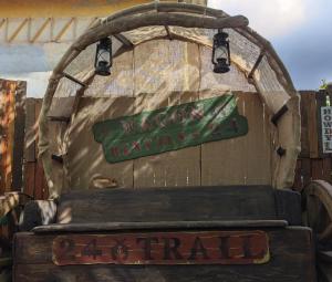 a sign on the back of an old truck at Fontana Wild West in Castelnuovo del Garda