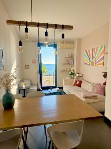 a living room with a table and a couch at Appartement Nice Promenade in Nice +14 photos