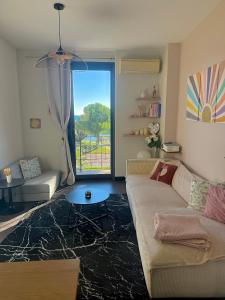 a living room with a couch and a table at Appartement Nice Promenade in Nice