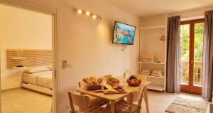 a room with a table with a bowl of fruit on it at Centro Storico di Merano in Merano
