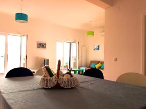 a pair of shoes sitting on a table in a living room at Casa Encosta da Lagoa in Foz do Arelho +27 photos