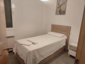 En eller flere senge i et værelse på Area Suites + 4 billeder