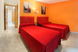 Posteľ alebo postele v izbe v ubytovaní Hostal Apolo Trece