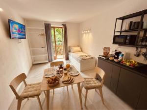 a kitchen with a table with food on it at Centro Storico di Merano in Merano