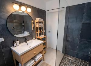 a bathroom with a sink and a mirror at Centro Storico di Merano in Merano +21 photos