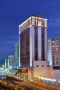 a large building with a hotel at night at Marriott Hotel Jabal Omar Makkah in Mecca