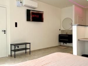 a room with a bed and a table on a wall at Salt Spa de Panne center in De Panne +9 photos