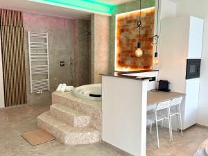 a bathroom with a sink and a bath tub at Salt Spa de Panne center in De Panne