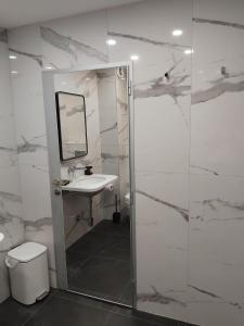 a bathroom with a sink and a mirror at Apartment Moni 3 in Veliko Tŭrnovo +18 photos