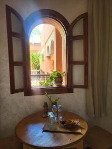 an arched window with a table with food on it at Ryad Fnina in Tiznit +28 photos