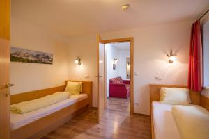 Posteľ alebo postele v izbe v ubytovaní Appartementhaus Chalet Alpina