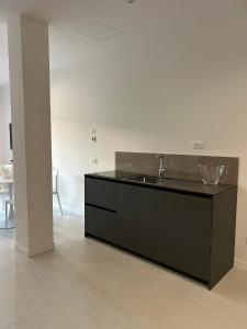 a kitchen with a sink and a counter at Casa Nane in Malcesine +92 photos