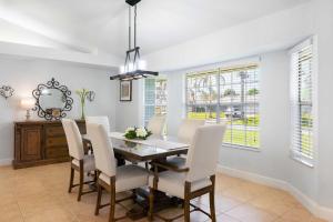 a dining room with a table and chairs at Spacious 5BR Pool Oasis Near Disney Resort in Sebastian