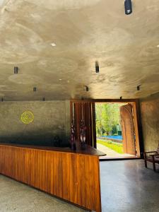 a room with a counter in the middle of a building at Aria Resort in Sigiriya +66 photos