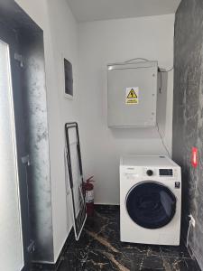a washer and dryer in a small room at Luxury LCF in Brăila