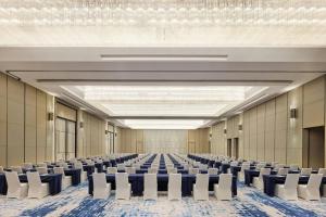 an empty hall with rows of chairs in it at Four Points by Sheraton Wuhan, Jiangxia in Wuhan +50 photos