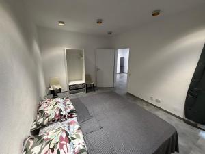 a bedroom with a bed and a mirror at WiLDBED DE Mitte in Bad Wildbad